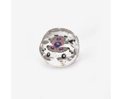 Glass Millefiori paperweight of hexagonal faceted form, H5cm