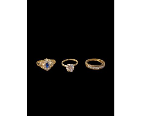 9ct gold cubic zirconia half eternity ring, 14ct gold blue cubic zirconia ring and a  14ct gold single stone ring Condition R