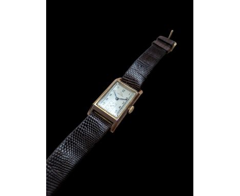 Record 9ct gold gentleman's manual wind tank wristwatch, silvered dial with subsidiary seconds dial, London 1950, on brown le