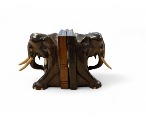 Pair of carved elephant bookends with bone tusks, H14.5cm