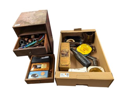 Table top set of wooden drawers containing a collection of pipes, together with a Phipps Brewers Northampton glass bottle, Wh