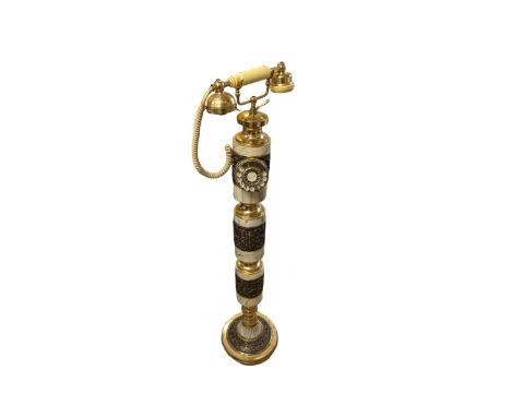 Tall Eastern brass and marble telephone, H105cm