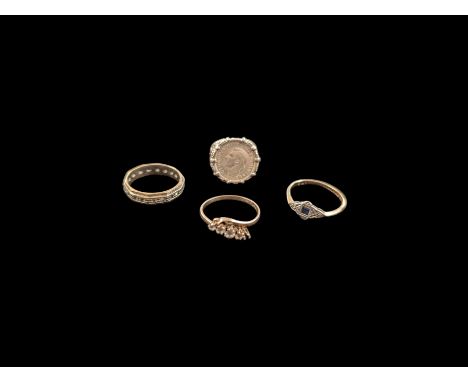 Three 9ct gold stone set rings and a coin set silver ringCondition Report:9ct approx 5.8 grams