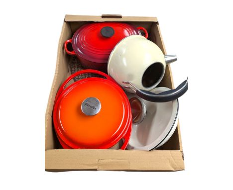 Le Creuset cooking pot in red, Berndes cooking pot in orange, Aga enamel dish, Aga kettle and an Aga toast maker