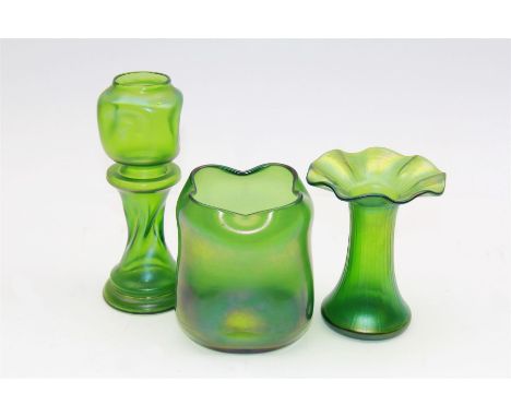 Three Austrian Art Nouveau green iridescent glass vases, to include two Loetz examples and a taller twisted and dimpled examp