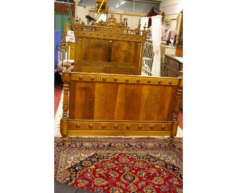 A PAIR OF VINTAGE EUROPEAN WALNUT 4ft 6ins BED ENDS with connecting irons, the headboard with carved top detail, balustrade f