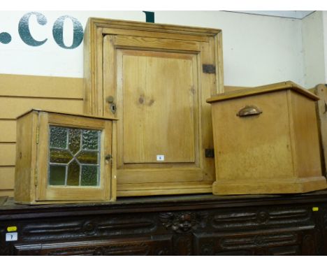 THREE PIECES OF VINTAGE STRIPPED PINE comprising a single door wall cupboard with interior shelves, a small leaded glass wall