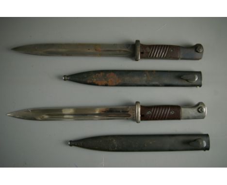 TWO GERMAN MAUSER BAYONETS both with scabbard, one stamped 'S/240', no. 1493, the scabbard stamped '44 FNJ' no. 8365, the oth