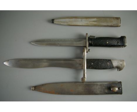 A SPANISH BOLO BAYONET AND ONE OTHER, the bolo with Toledo stamped blade, no. 5024J, the scabbard stamped 5475I, 37 cms long 