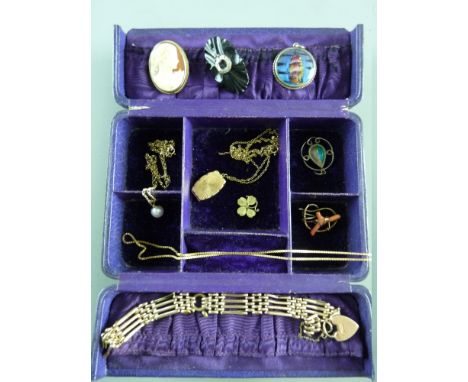 AN EDWARDIAN JEWELLERY CASE & CONTENTS including a nine carat gold locket and chain with two further nine carat gold fine nec
