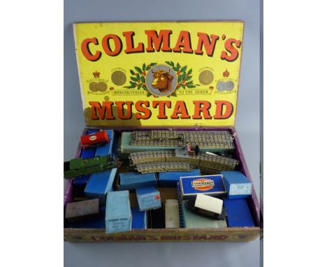 A VINTAGE HORNBY DUBLO TRAIN SET in a Coleman's Mustard box including a 9596 LNER locomotive, boxed and unboxed goods wagons 