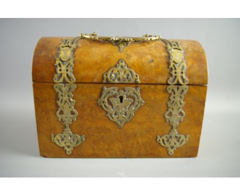 A VICTORIAN WALNUT STATIONERY BOX of dome lidded casket form with gilt pierced brass handle and strapwork decoration, the int