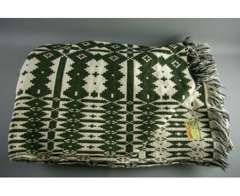 A LARGE VINTAGE WELSH WOOLLEN BLANKET with Brynkir label, traditional double sided pattern in cream and green tones