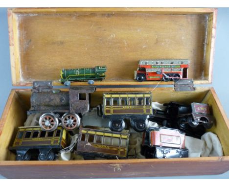 A VINTAGE TINPLATE CLOCKWORK TRAIN with carriages, a Brimtoy double decker bus and a small clockwork locomotive in a lidded w
