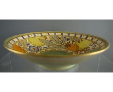 A BURSLEY WARE CHARLOTTE RHEAD DECORATED FRUIT BOWL with tube lined fruit and floral decorated interior, in colourful lustres