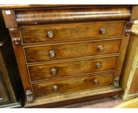 A VICTORIAN MAHOGANY SCOTTISH STYLE CHEST of five long drawers with carved corbel front decoration and turned wooden knobs wi