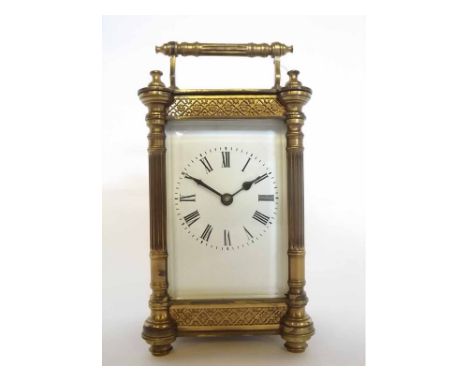 Early 20th century French lacquered brass cased carriage timepiece, case with fluted carrying handle and three-quarter column