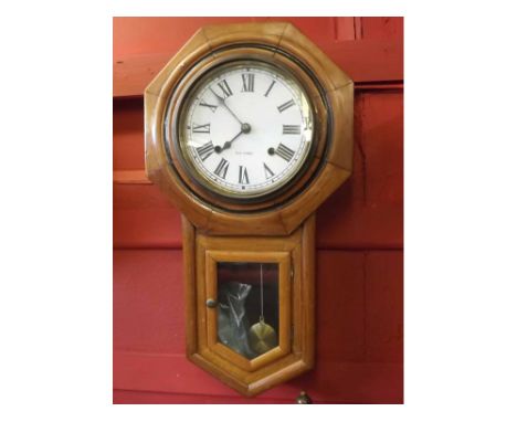 Early 20th century American drop dial wall clock, the sectioned and moulded surround over drop trunk with glazed and hinged d