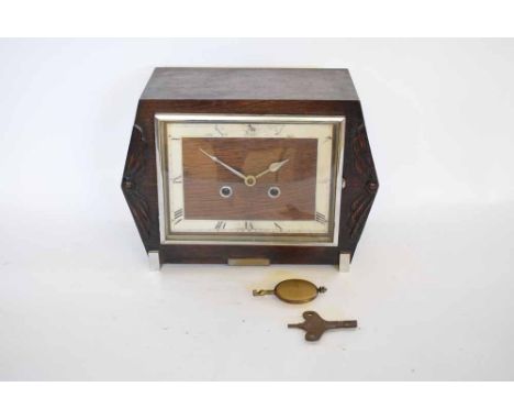 First half of 20th century stained oak and chrome plated mantel clock, the squat rectangular case with applied carved detail 