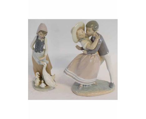 Lladro group of girl with geese, and further group of young couple embracing, both approx 25cms high  