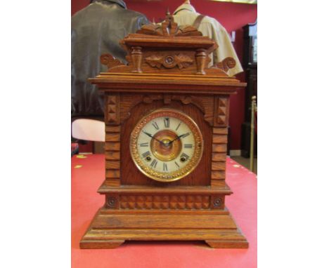 Early 20th century American oak cased mantel clock, Ansonia "Syria", case with overhanging cornice and shaped pediment on a s