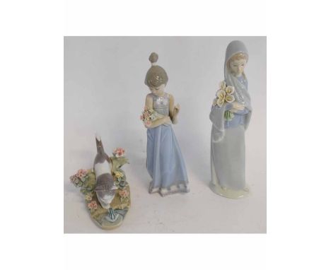 Two Lladro figures of girls with bunches of flowers and a further Lladro group of cat and a frog, various sizes (boxes availa