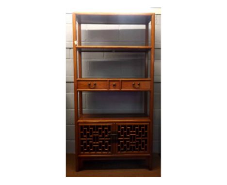 Oriental hardwood side cabinet of three shelves with cupboard below, central shelf with drawers, 180cms high 