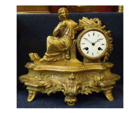 Late 19th century French gilt spelter figural mantel clock, the drum shaped case flanked by a classical figure and further mu