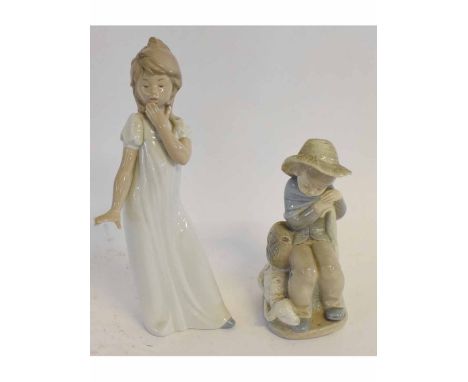 Nao figure of a young girl and a further Spanish figure of a young shepherd boy with sheep, 30cms and 18cms high respectively