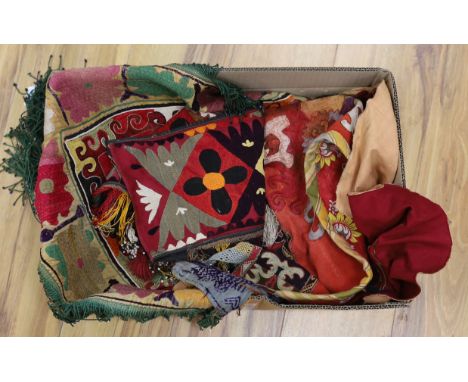 A late 19th/early 20th century Uzbek (Ladak tribe) corner of a multi coloured embroidered hanging, bordered with green and wh