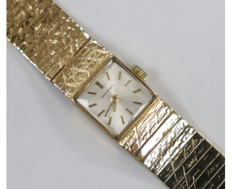 A lady's 1960's 9ct gold Jean Renet manual wind bracelet watch, overall 17.6cm, gross weight 33.6 grams.