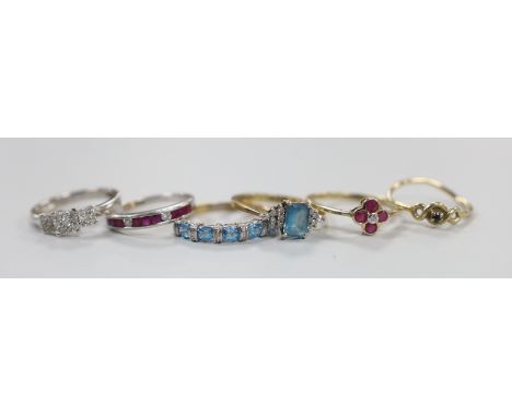 A modern 9ct white gold and diamond chip triple square cluster ring and a similar ruby and diamond set half hoop ring, togeth