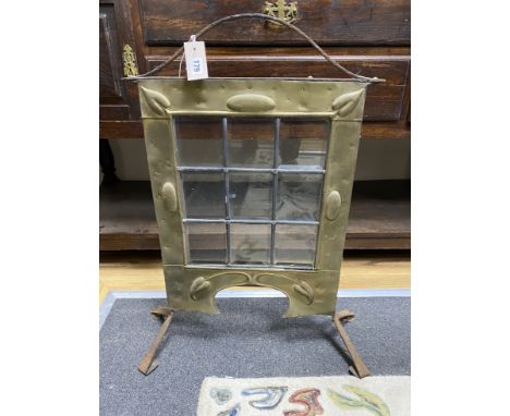 An Art Nouveau glazed brass and wrought iron firescreen, height 76cm