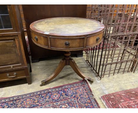 A reproduction mahogany small drum table with tooled green leather top, diameter 76cm, height 71cm