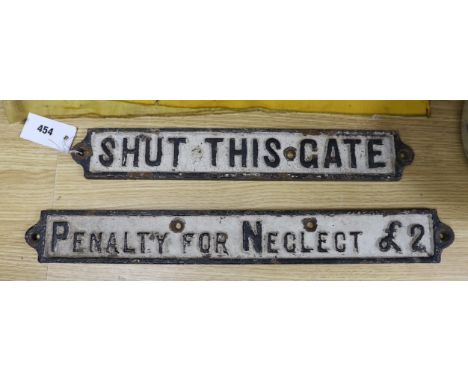 Two cast iron signs 'shut this gate' and 'penalty for neglect £2'
