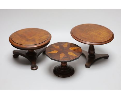 Three 19th century apprentice miniature table or doll’s house furniture; parquetry and two tripod tables, tallest 14cm