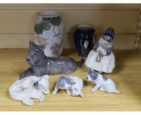 Four Royal Copenhagen figures and animals, two similar vases and a Bing and Grondahl terrier