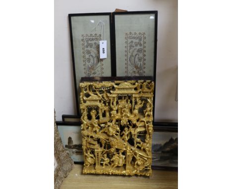 A Chinese carved giltwood  ‘warriors’ panel, 45cm x 30cm a pair of sleeve bands and three framed Chinese cut feather pictures