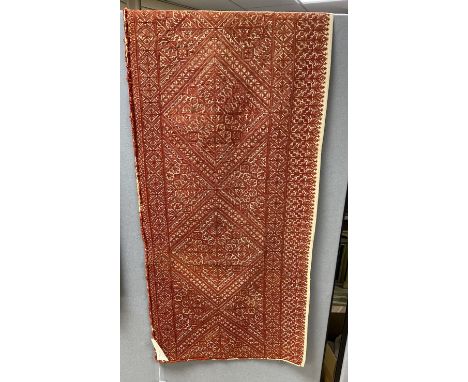 A late 19th early 20th century Fez embroidered table runner, with an all over rust silk design, 124cm wide, 44cm deep