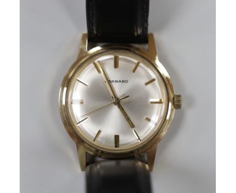 A gentleman's early 1970's 9ct gold manual wind wrist watch, retailed by Garrards, with case back inscription, on  a leather 