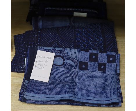 Four 20th century Nigerian Adire, indigo dyed, batik printed, cotton hangings, all with different designed motifs on short lo