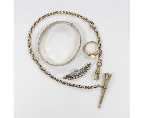 A silver hinged bangle and three other items including a paste set brooch.