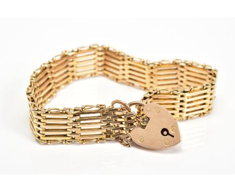 A GATE BRACELET, designed with a heart padlock clasp and safety chain, stamped 15ct, length 180mm, approximate weight 20.5 gr