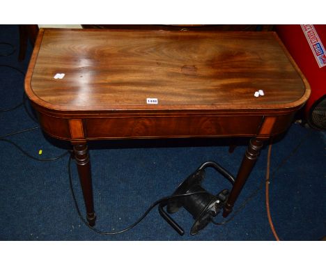 A GEORGIAN MAHOGANY, BOXWOOD AND EBONY STRUNG FOLD OVER CARD TABLE, blue baize interior on four cylindrical tapering legs, wi