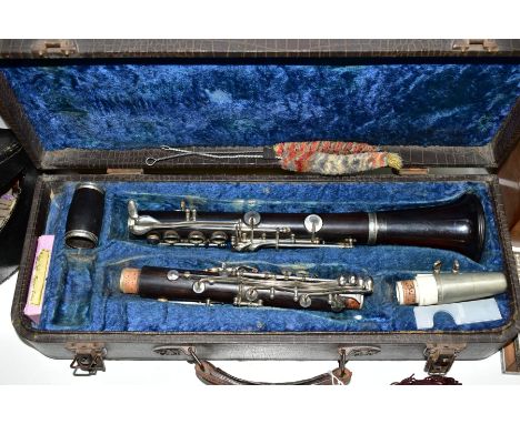 A LATE 19TH CENTURY/EARLY 20TH CENTURY EBONY CASED CLARINET, English made, serial number 142476