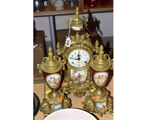 A GERMAN BRASS CLOCK GARNITURE, in the Louis XIV style, with painted panels, enamel dial with Arabic numerals, marked Franz H