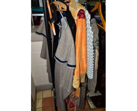 TWO LONG WOOL CARDIGANS, one knitted and one crocheted,a long jacket by Lloyd, England, a sequin jacket and a cloak (5)