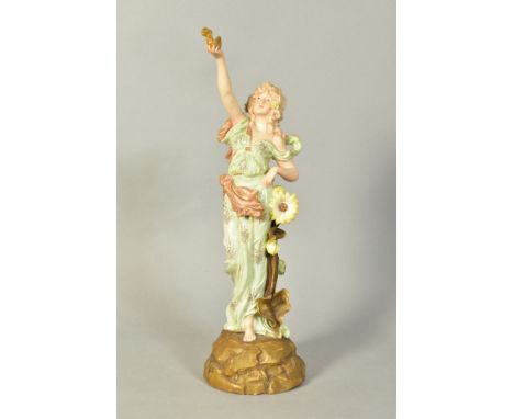 E.W.TURN, WIEN, AUSTRIAN PORCELAIN FIGURE, depicting woman holding lantern/lamp with fire coming out, standing next to sunflo