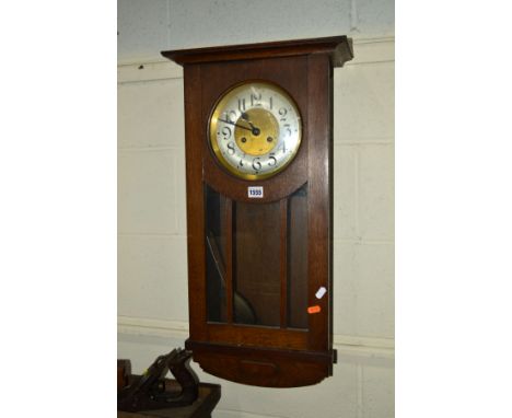 AN EARLY 20TH CENTURY OAK WALL CLOCK together with slate mantel clock with eratic numerals, an Art Deco mantel clock and an o