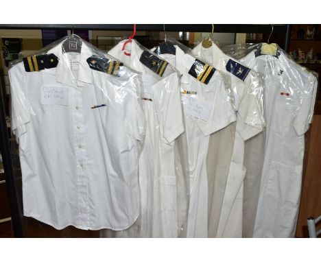 FIVE ITEMS OF WOMENS NAVAL UNIFORMS IN WHITE, one R N blouse, three US Navy shift dresses, one US Air Force shift dress, toge